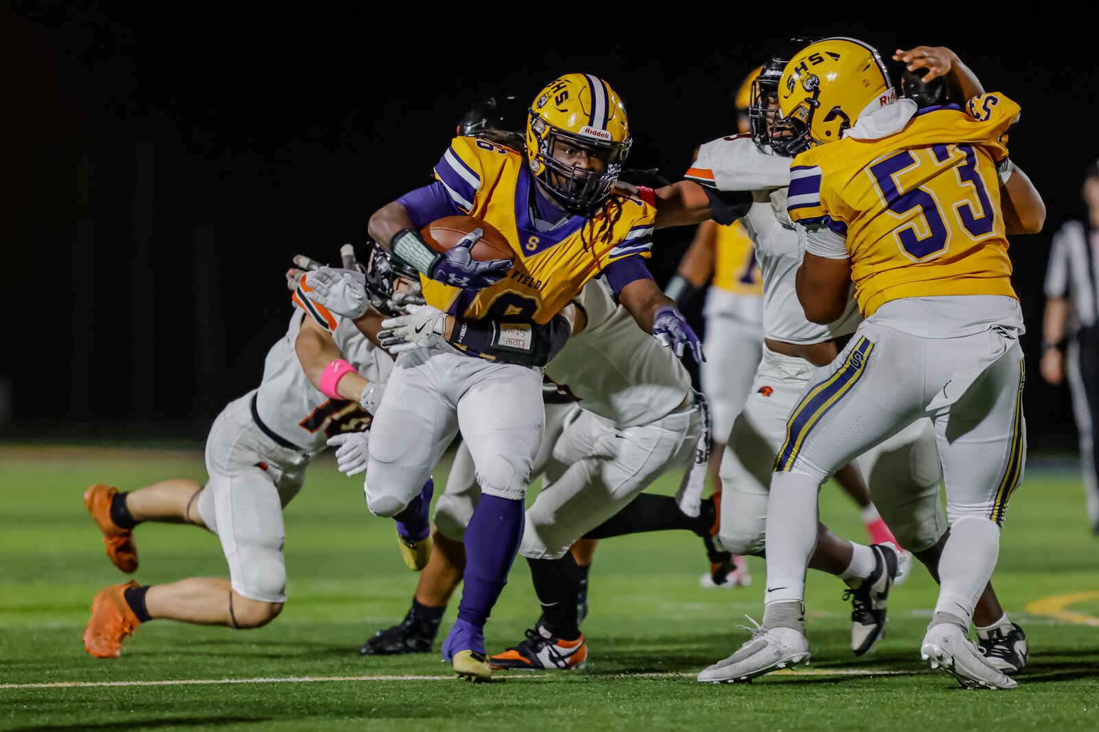 Springfield High School junior Chris Summers runs the ball against Beavercreek during their game on Friday, Oct. 10 at Wildcat Stadium in Springfield. The Wildcats won 31-0. MICHAEL COOPER / STAFF