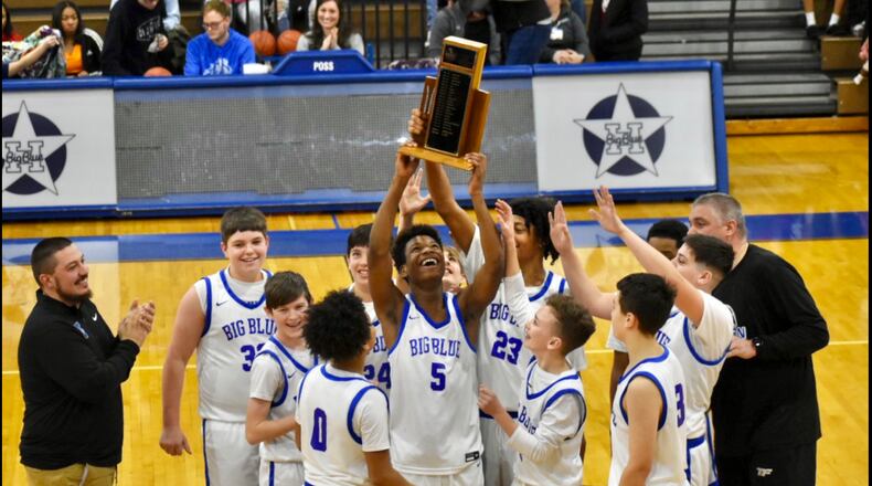 A first-year strategy to combine the Hamilton Schools’ boys and girls basketball teams into single middle school squads has already paid off in historic fashion. The joint boys’ team from Wilson and Garfield middle schools has produced for the first time in 17 years an undefeated 7th grade squad that then won the GMC middle school league championship in a recently completed league tournament. The team (pictured) recently hoisted the GMC trophy at center court after winning it all. CONTRIBUTED