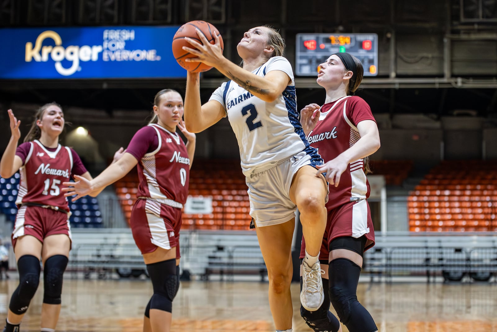 Fairmont High School senior Nico Cornett drives past Newark junior Emma Quackenbush during their Division I regional semifinal game on Tuesday, March 3 at the Ohio Expo Center's Taft Coliseum. MICHAEL COOPER / STAFF