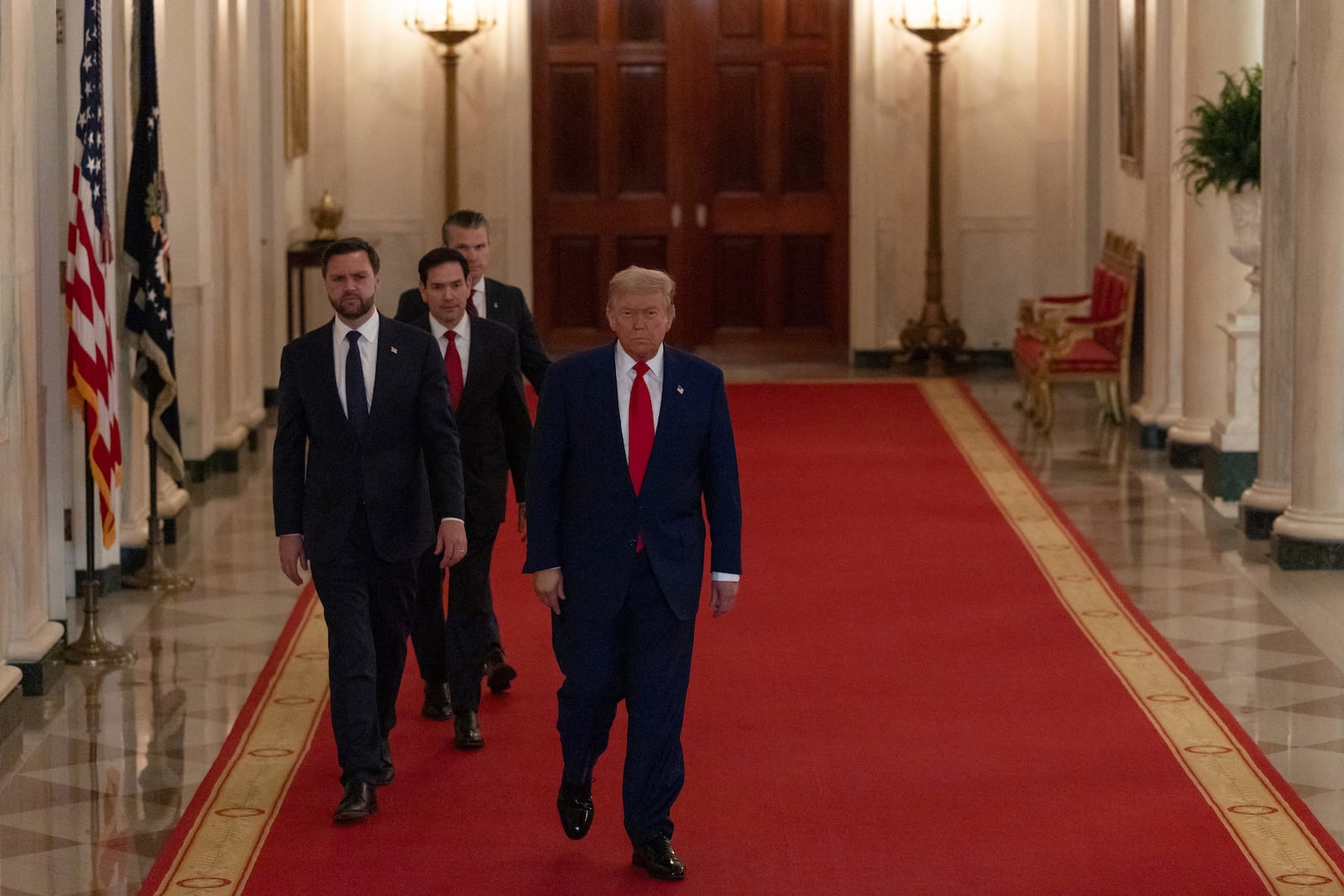 President Donald Trump arrives to speak from the East Room of the White House in Washington, Saturday, June 21, 2025, after the U.S. military struck three Iranian nuclear and military sites, directly joining Israel's effort to decapitate the country's nuclear program, with Vice President JD Vance, Secretary of State Marco Rubio and Defense Secretary Pete Hegseth. (Carlos Barria/Pool via AP)
