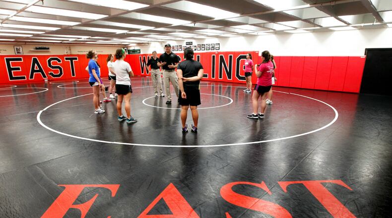 West Chester Police Officers Phil Chaney and Michelle Berling lead a self-defense class Monday, May 12, 2014, at Lakota East High School. NICK DAGGY / STAFF