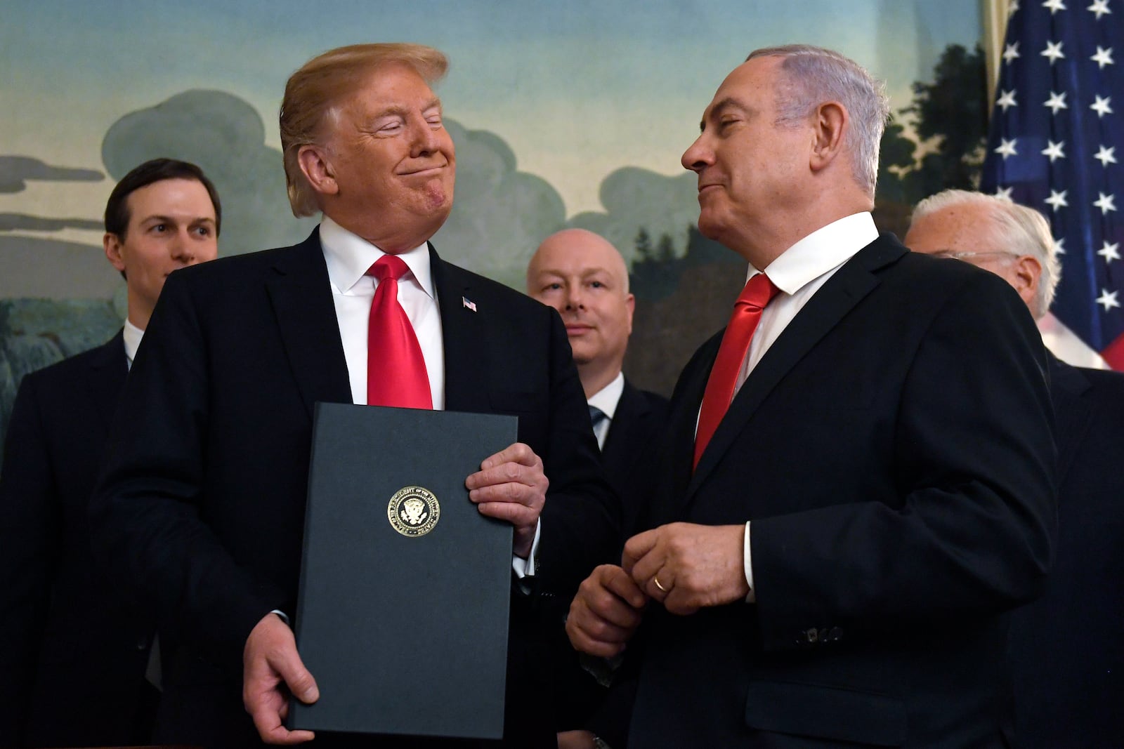 FILE - In this March 25, 2019 file photo, President Donald Trump smiles at Israeli Prime Minister Benjamin Netanyahu, right, after signing a proclamation at the White House in Washington. (AP Photo/Susan Walsh, File)