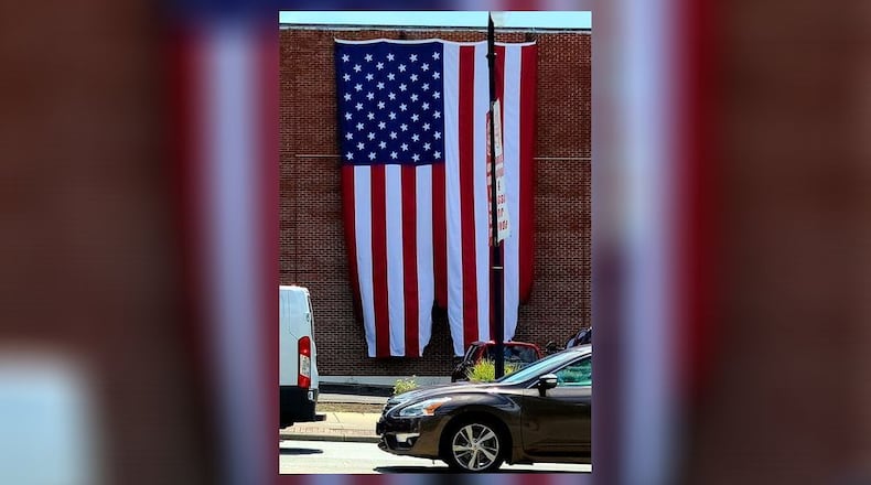 A flag hanging on the Presbyterian Church of Hamilton at Front and High streets was damaged by arson early Monday morning. SUBMITTED