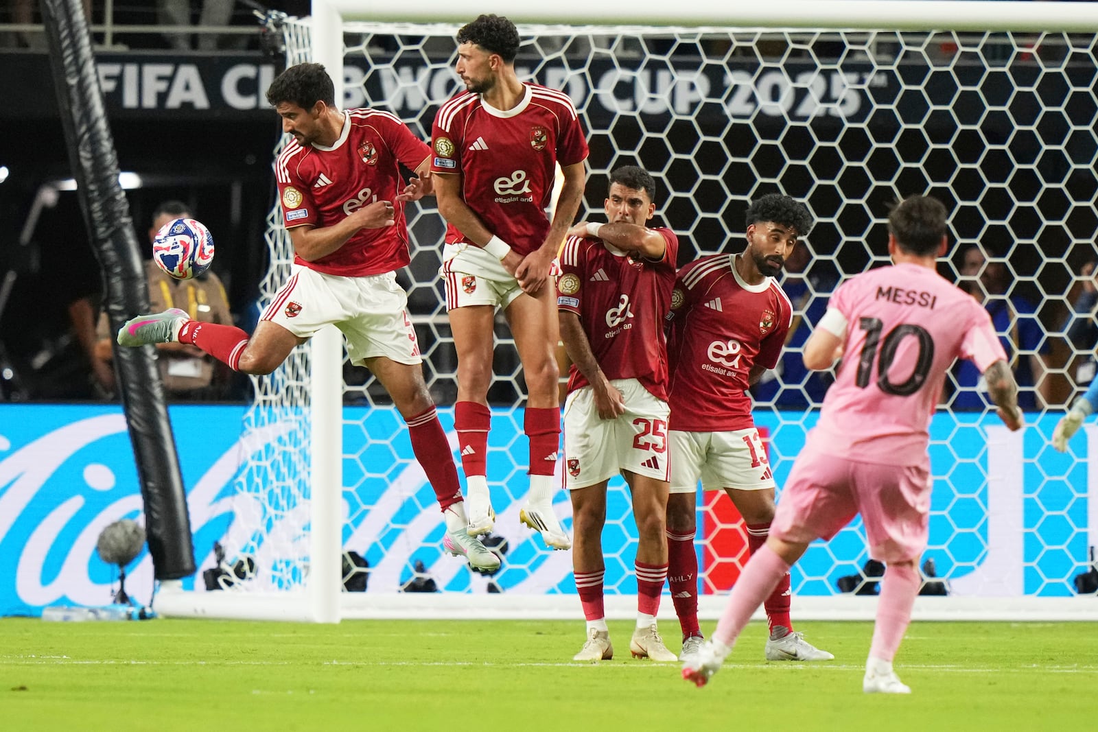 Inter Miami's Lionel Messi, right, watches his free kick pass the wall of defenders during the Club World Cup group A soccer match between Al Ahly and Inter Miami in Miami, Fla., Saturday, June 14, 2025. (AP Photo/Lynne Sladky)