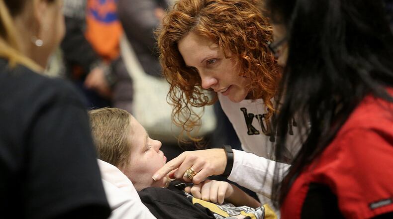 Rebecca Bradley checks on her son, Kyler, 10, before he greets all the well-wishers gathered at BridgeWater Church in Fairfield Twp. Saturday, Jan. 23, 2016. CONTRIBUTED PHOTO BY E.L. HUBBARD