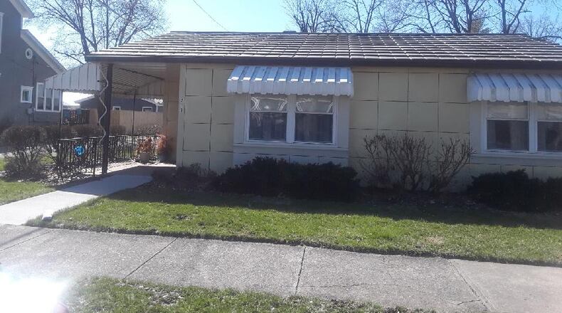 The steel house at 219 S. Cherry St. in Germantown is for sale. The Lustron home is maize yellow.