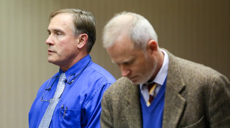 Oxford doctor Rick Bucher, left, with attorney Christopher Pagan, appeared before Judge Greg Stephens in Butler County court, Monday, Nov. 14, for a pre-trial hearing on charges of trafficking drugs. GREG LYNCH / STAFF