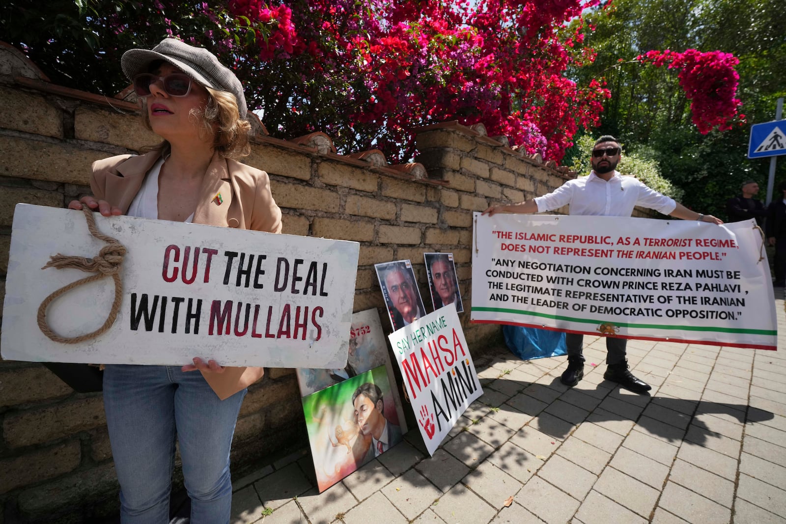 Iranian citizens protest against the current Iranian government outside the Omani Embassy in Rome during the closed-door meeting between U.S. and Iranian delegations to discuss Tehran's rapidly advancing nuclear program, Friday, May 23, 2025. (AP Photo/Andrew Medichini)