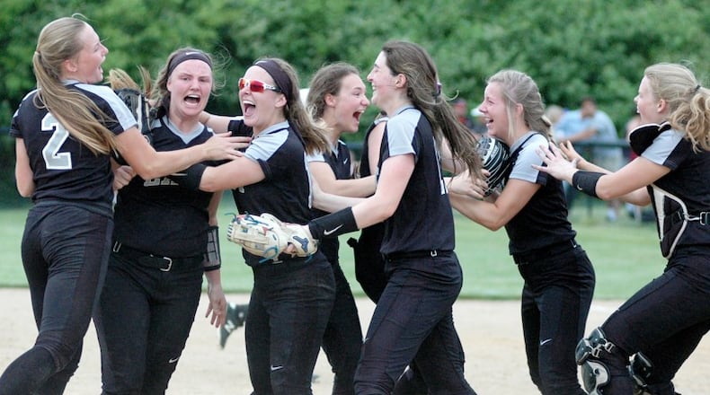 Lakota East’s players celebrate May 22 after a Division I regional softball semifinal against Mason at Centerville. East won 5-4 in 10 innings. RICK CASSANO/STAFF