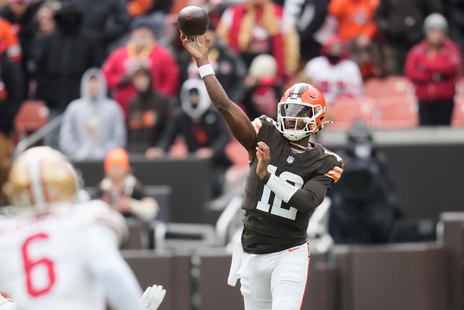 Cleveland Browns quarterback Shedeur Sanders (12) passes against the San Francisco 49ers during the first half of an NFL football game, Sunday, Nov. 30, 2025, in Cleveland. (AP Photo/Sue Ogrocki)