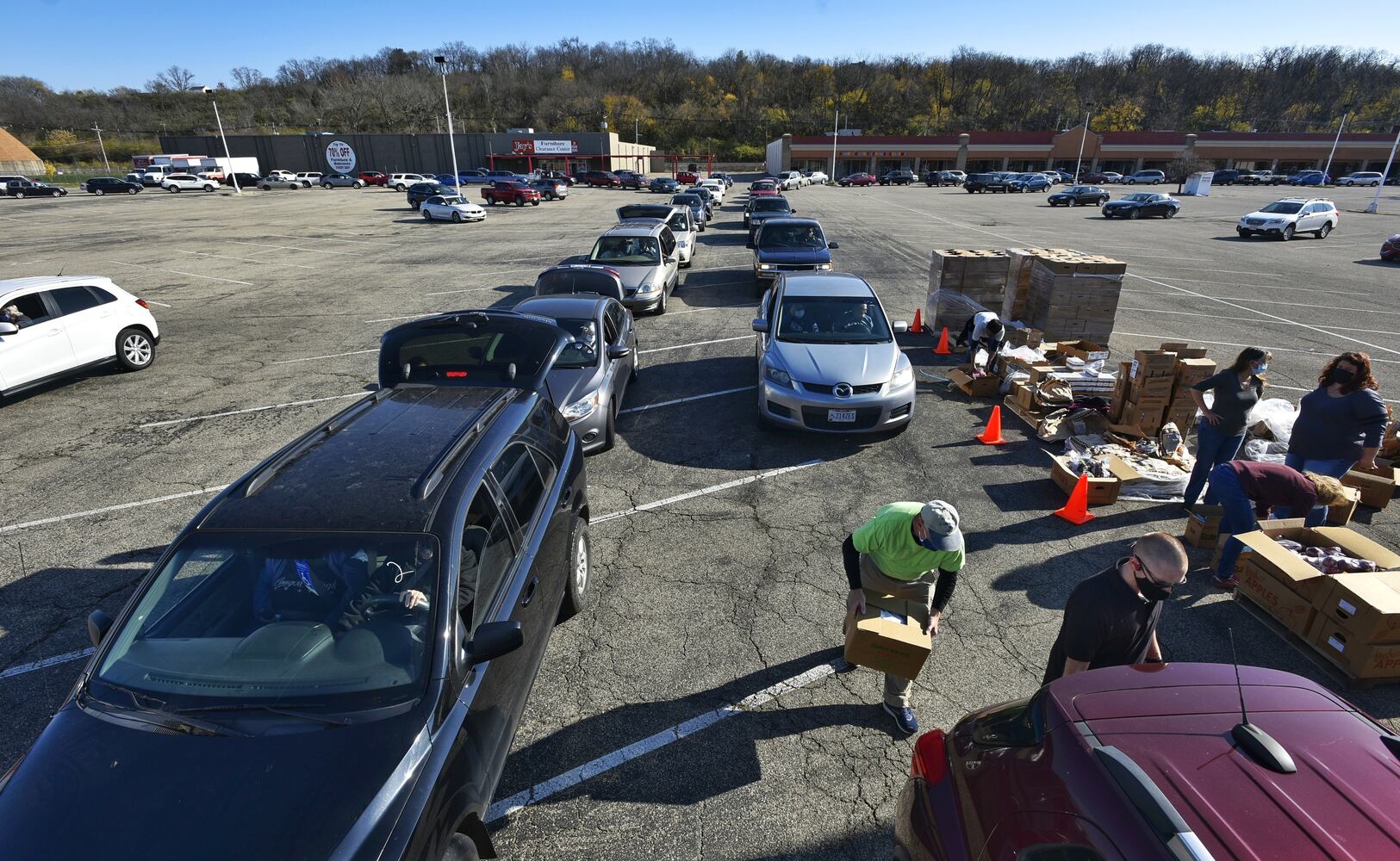 More than 100 cars at a time line up for senior food giveaway in Hamilton
