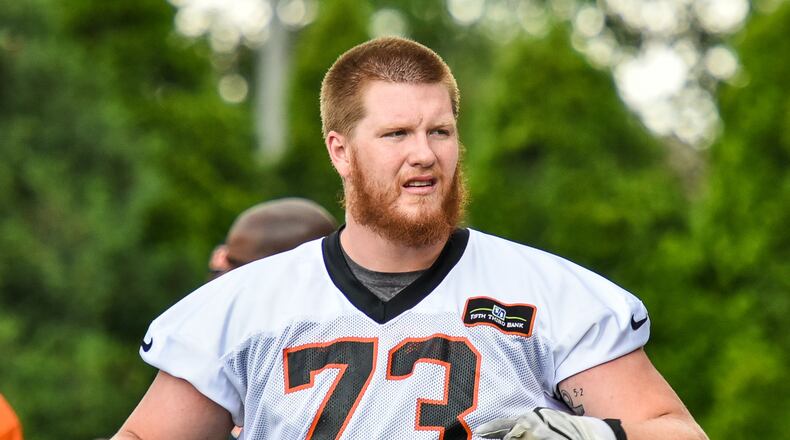 Bengals’ rookie offensive tackle Austin Fleer stretches during organized team activities Tuesday, May 22 at the practice facility near Paul Brown Stadium in Cincinnati. NICK GRAHAM/STAFF