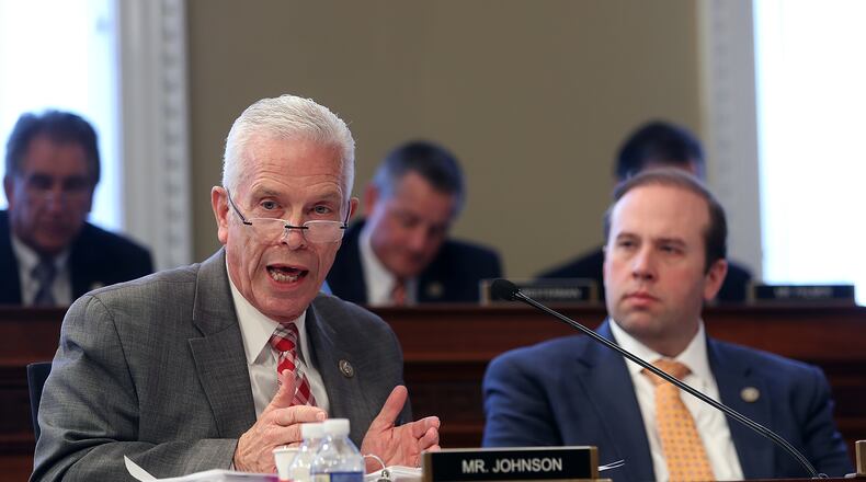 U.S. Rep. Bill Johnson (L) (R-OH) speaks as Rep. Jason Smith (R) (R-MO) looks on during a House Budget Committee markup of the Republican health care bill on Capitol Hill on March 16, 2017 in Washington, DC.