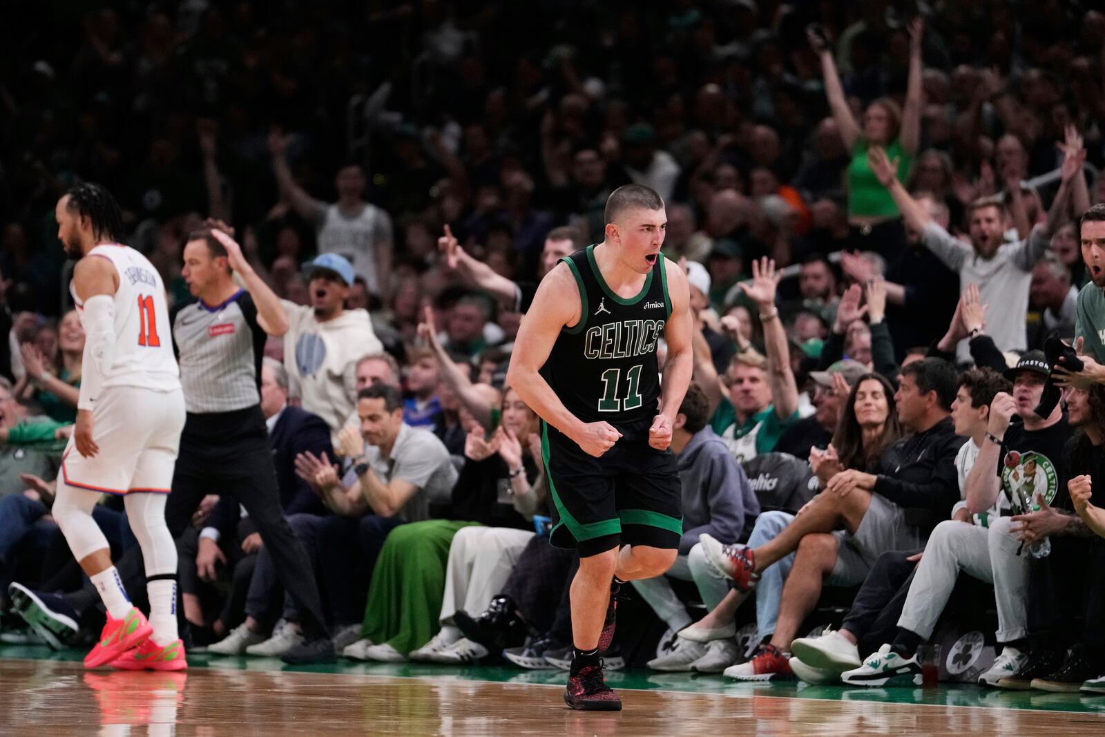 Boston Celtics guard Payton Pritchard celebrates after hitting a basket against the New York Knicks during the second half of Game 5 of an NBA basketball second-round playoff series, Wednesday, May 14, 2025, in Boston. (AP Photo/Charles Krupa)