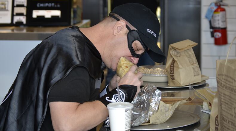 Bruce Wayne, of Tiffin, eats his 426th consecutive Chipotle meal.CONTRIBUTED