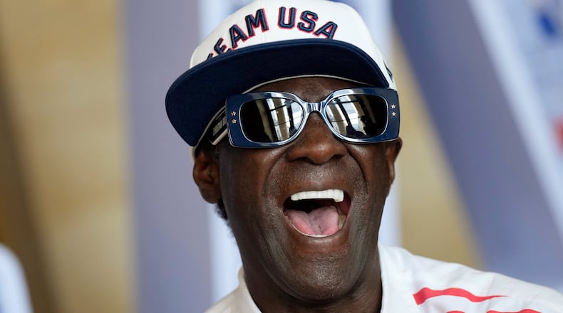 FILE - Flavor Flav laughs during an interview with The Associated Press at the USA house at the 2024 Summer Olympics, July 25, 2024, in Paris, France. (AP Photo/Luca Bruno, file)