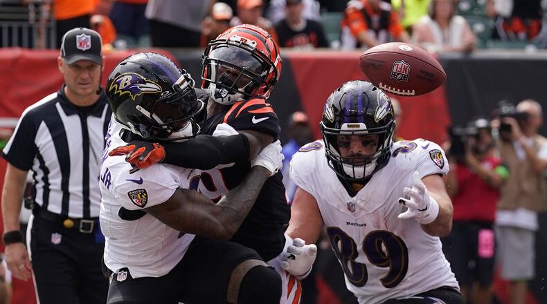 Cincinnati Bengals cornerback Cam Taylor-Britt, center, breaks up a pass intended for Baltimore Ravens wide receiver Odell Beckham Jr., left, as Ravens tight end Mark Andrews (89) gets in on the play during the first half of an NFL football game Sunday, Sept. 17, 2023, in Cincinnati. (AP Photo/Darron Cummings)