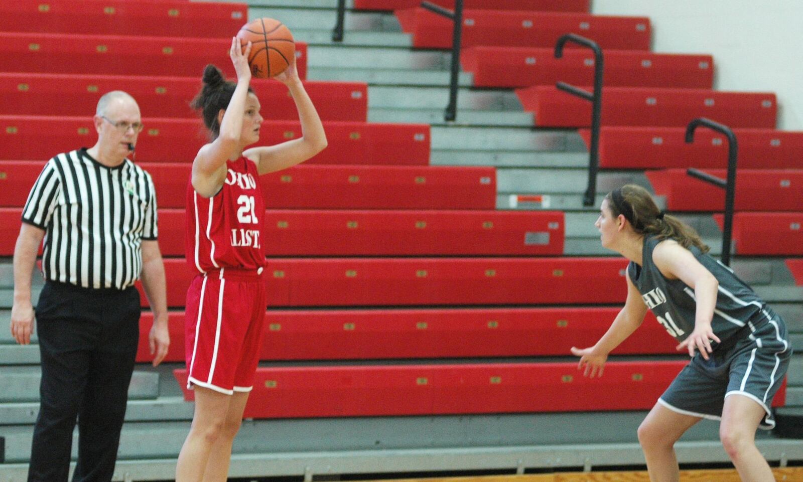 Franklin’s Layne Ferrell, playing for the South, looks to make a pass Friday night during the Ohio High School Basketball Coaches Association North-South Division I-II All-Star Game at Denison University’s Mitchell Center. Guarding her is the North’s Annie Roshak of North Canton Hoover. The South won 131-77. RICK CASSANO/STAFF