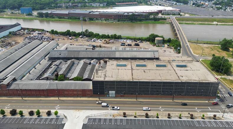 Hamilton is completing a development agreement with Dublin-based Crawford Hoying that includes a $3 million forgivable loan to redevelop the Cohen Recycling plant. Crawford Hoying is planning a three-phase project that will invest a minimum of $150 million to construct a new mixed-use development that includes retail space, a hotel, apartments, and townhomes. NICK GRAHAM/STAFF