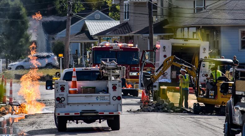A gas leak with fire forced the evacuation of a section of Lafayette Avenue Wednesday, Oct. 2 in Middletown. Middletown police and fire departments evacuated the area and a bus was brought in get residents out of the area until it was safe to return to their homes. Duke Energy was able to shut off the gas around 11:30 a.m. NICK GRAHAM/STAFF