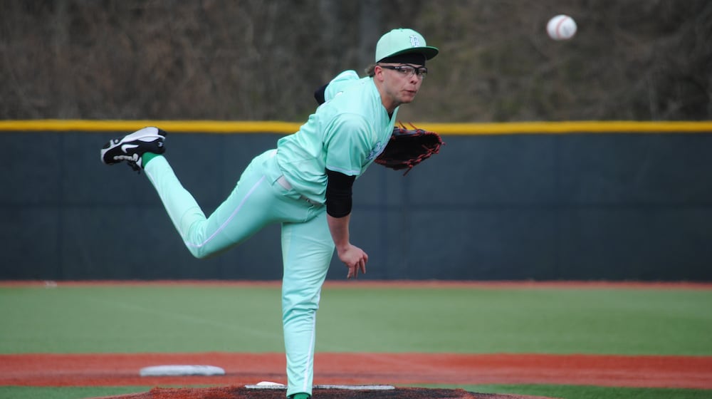 Badin senior Beau Chaney sends a pitch to the plate during the Rams' 7-0 loss against Toledo St. Francis de Sales on Friday afternoon at Xenia's Athletes in Action. CHRIS VOGT / CONTRIBUTED