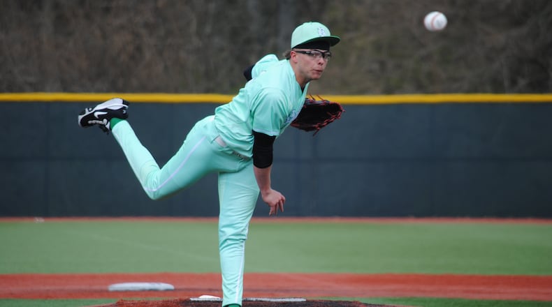 Badin senior Beau Chaney sends a pitch to the plate during the Rams' 7-0 loss against Toledo St. Francis de Sales on Friday afternoon at Xenia's Athletes in Action. CHRIS VOGT / CONTRIBUTED