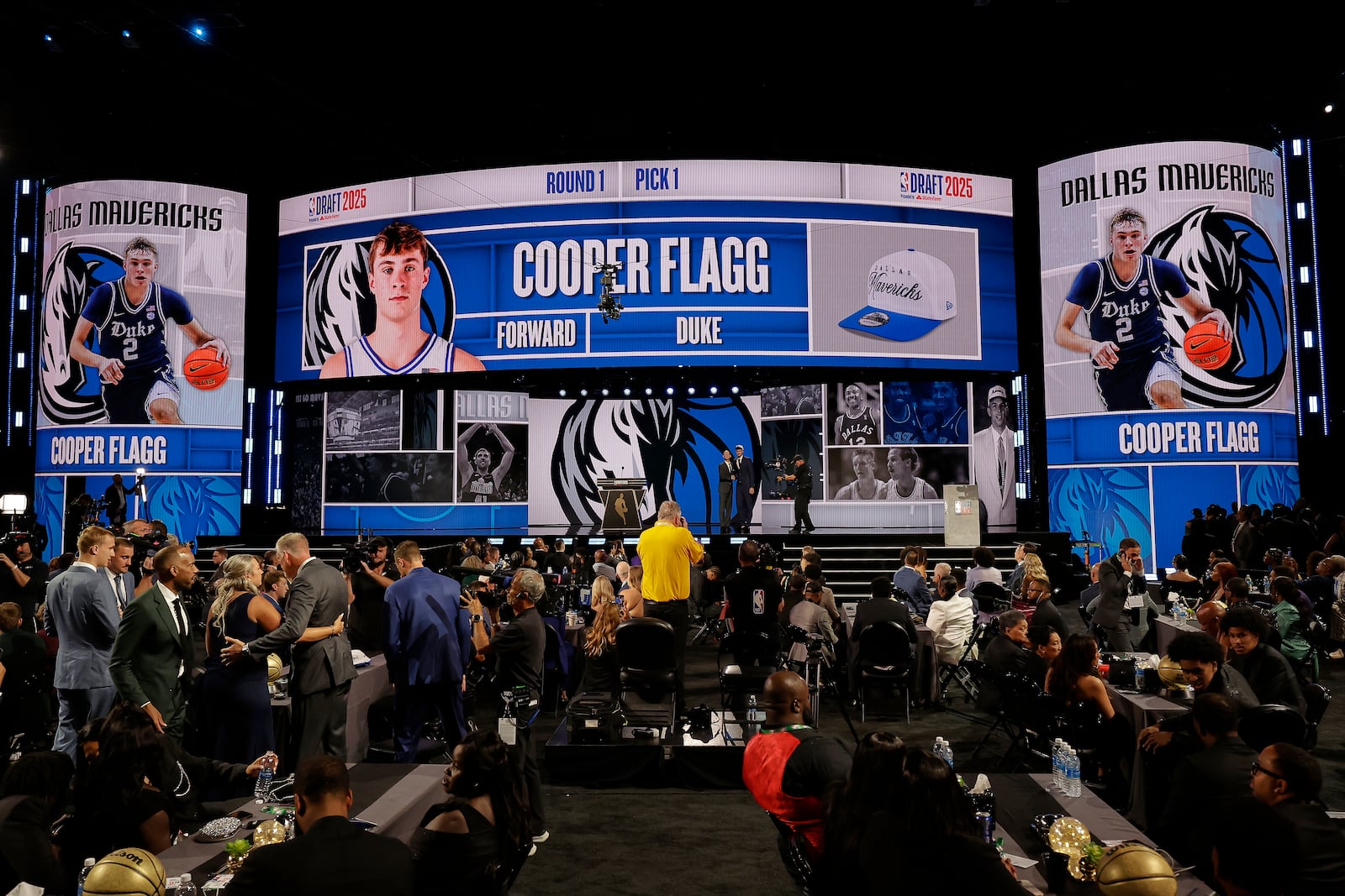Cooper Flagg, right, poses for a photo with NBA commissioner Adam Silver after being selected first overall by the Dallas Mavericks In the first round of the NBA basketball draft, Wednesday, June 25, 2025, in New York. (AP Photo/Adam Hunger)