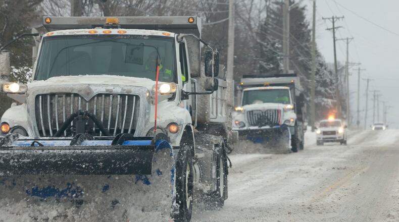 Huber Heights snow plows work together to clear Chambersburg Road Monday, Jan. 6, 2025. BILL LACKEY/STAFF