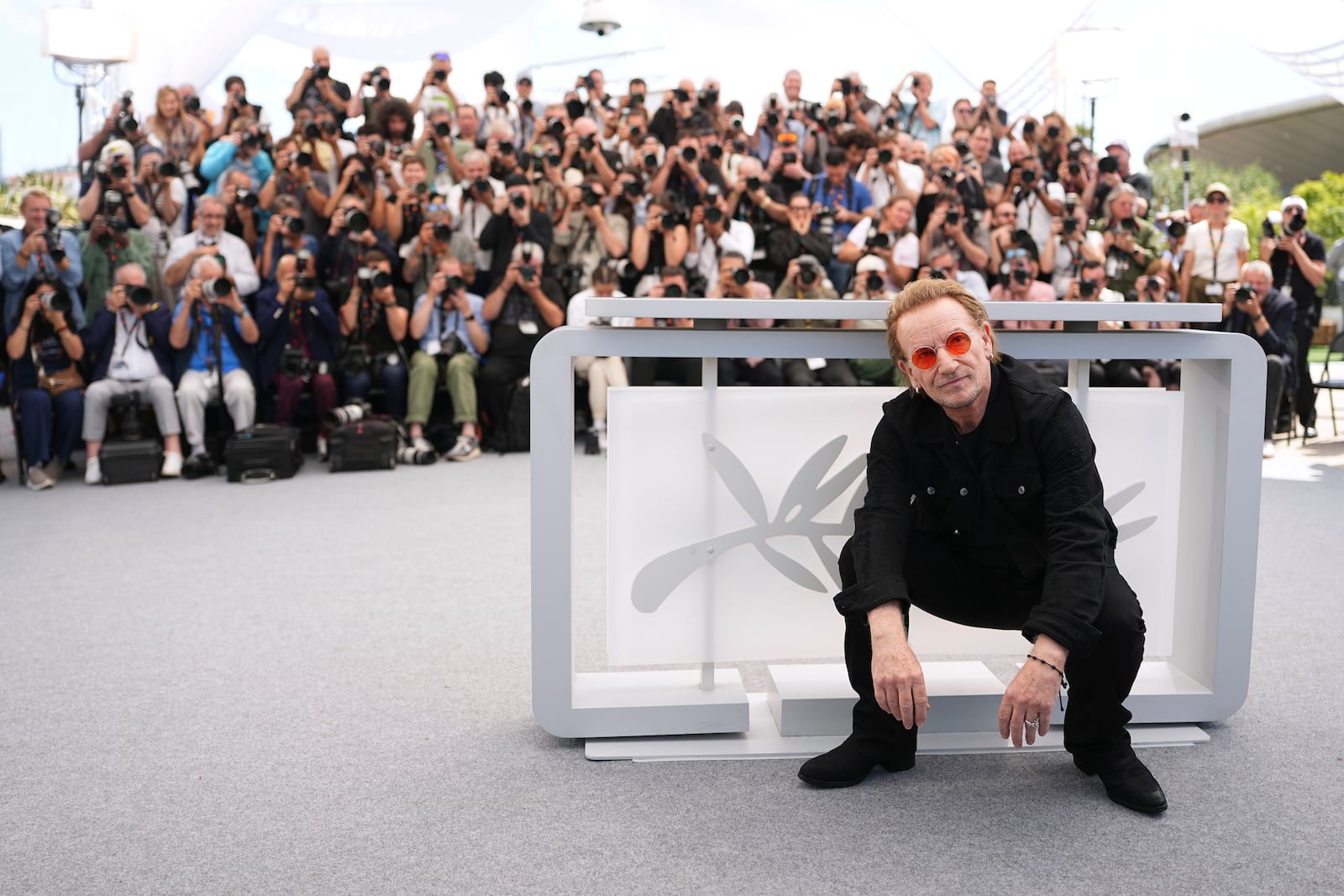 Bono poses for photographers at the photo call for the film 'Bono: Stories of Surrender' at the 78th international film festival, Cannes, southern France, Saturday, May 17, 2025. (Photo by Scott A Garfitt/Invision/AP)