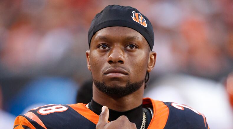 Cincinnati Bengals running back Joe Mixon stands on the sidelines during the first half of an NFL preseason football game against the New York Giants, Thursday, Aug. 22, 2019, in Cincinnati. (AP Photo/Frank Victores)