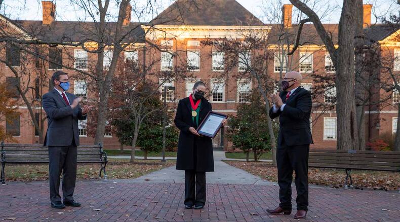 Earlier this month Miami’s Martha Castañeda, professor of Teacher Education, was the focus of an outdoor ceremony near the famed seal of the school as she received the President’s Medal from school officials including President Gregory Crawford. (Provided Photo\Journal-News)