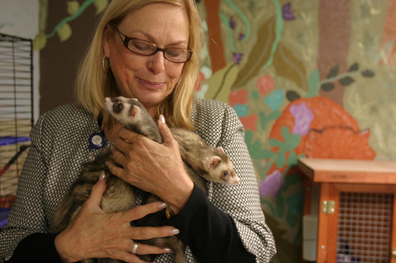 Barb Condo holds two ferrets Monday, Nov. 20, 2006, which are animals at One Way Farm's pet therapy program. Donations to the organization are needed to help take care of the animals, along with help provide food, clothing and other needs of the children at One Way Farm. STAFF FILE PHOTO