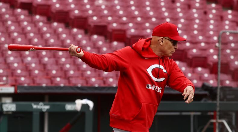 Reds manager Terry Francona hits grounders before a game against the Giants on Opening Day at Great American Ball Park on Thursday, March 27, 2025, in Cincinnati. David Jablonski/Staff