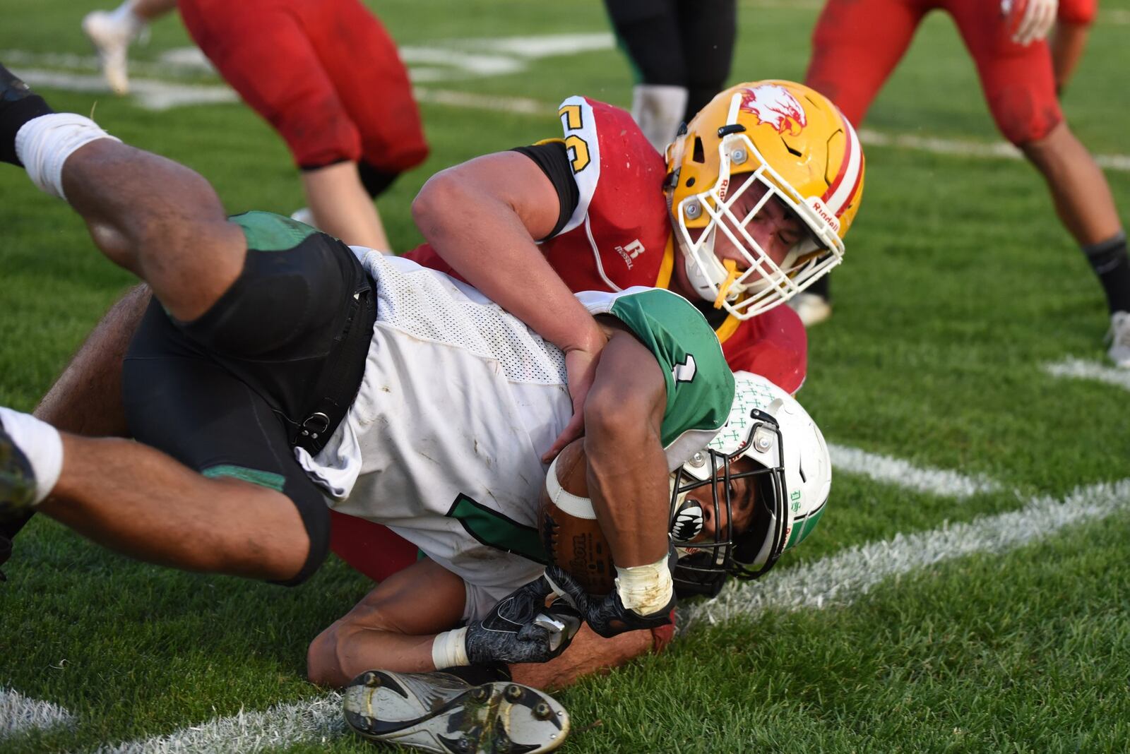 Fenwick’s Sam Secrest tackles Badin’s Davon Starks during Friday night’s game at Krusling Field in Middletown. Fenwick posted a 21-9 victory. CONTRIBUTED PHOTO BY ANGIE MOHRHAUS