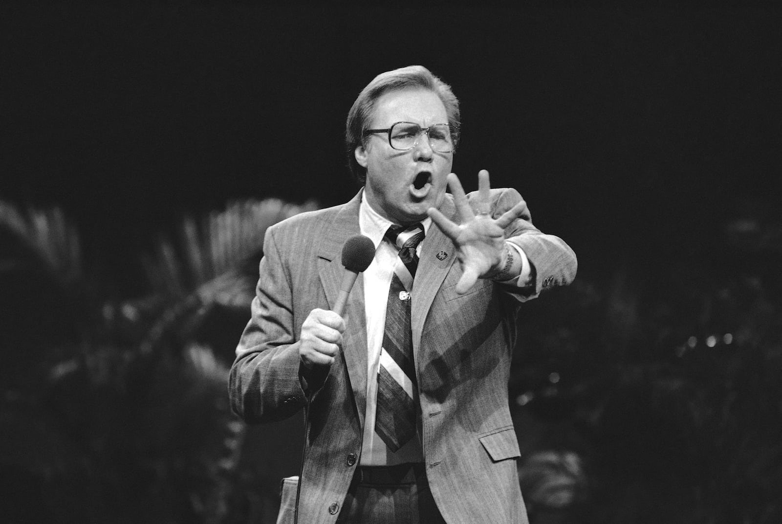FILE - Members of the audience react to evangelist Jimmy Swaggart during a recent rally in Milwaukee, Feb. 10, 1985. (AP Photo/Joseph Jensen Jr, file)
