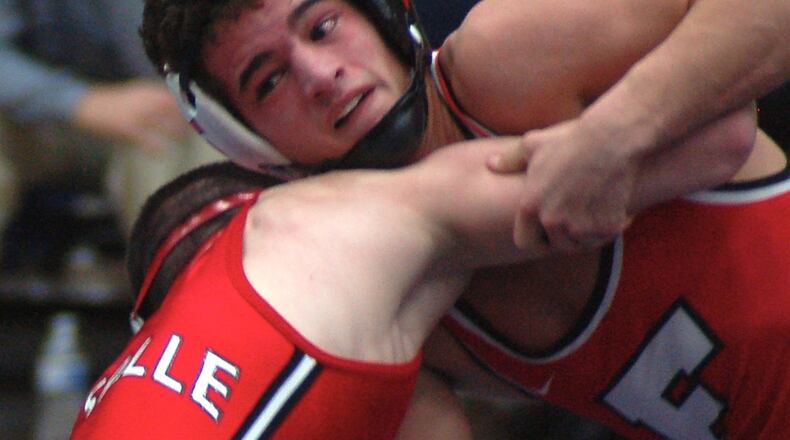 Fairfield’s Zach Shupp looks for an opening to attack La Salle’s Lucas Byrd during their 106-pound title match at the Division I district tournament at Fairmont’s Trent Arena last season. CONTRIBUTED PHOTO BY JOHN CUMMINGS