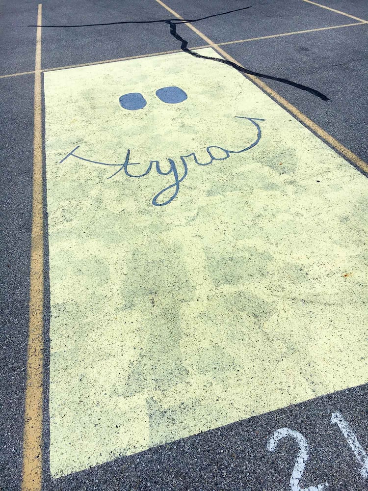 PHOTOS Lakota East seniors paint parking spots