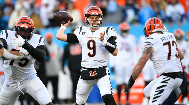 Cincinnati Bengals quarterback Joe Burrow (9) pases from the pocket against the Tennessee Titans during the first half of an NFL divisional round playoff football game, Saturday, Jan. 22, 2022, in Nashville, Tenn. (AP Photo/John Amis)