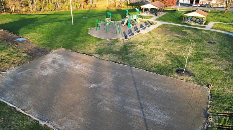 The Hamilton Parks Conservancy District is installing a basketball court at Jim Grimm Park, which is a direct result of four high school students in March 2023 asked City Council for more activities for residents their age. Hamilton worked with the Parks Conservancy District and are addressing those concerns, needs and wants in the community, including this basketball court, which could be ready for use as early as by the end of this year. A gravel base has been laid for the court, pictured here, ahead of the asphalt being poured. NICK GRAHAM/STAFF