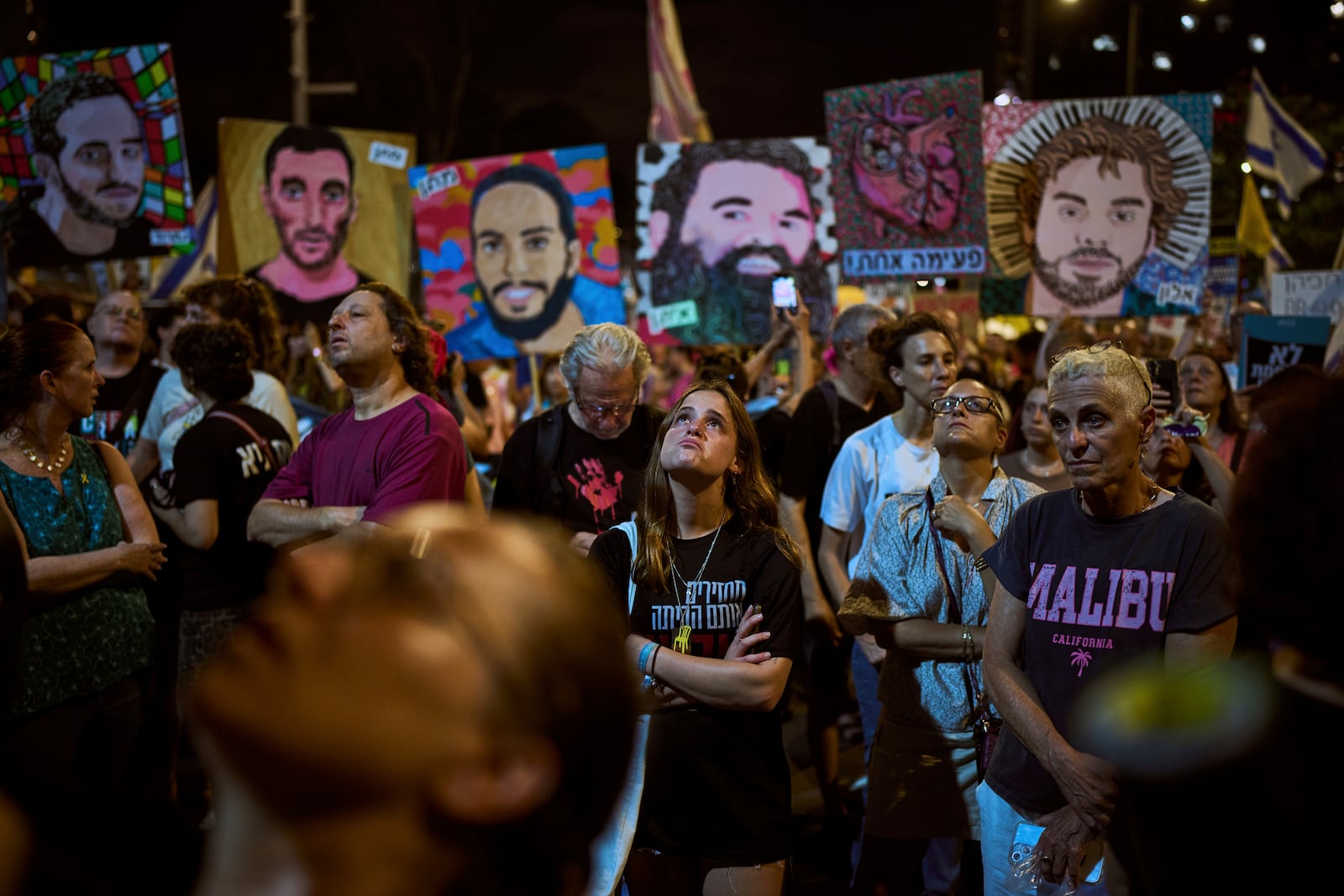 Relatives and supporters of Israeli hostages held in the Gaza Strip attend a rally demanding their release from Hamas captivity and calling for an end to the war, in Tel Aviv, Israel, Saturday, July 12, 2025. (AP Photo/Oded Balilty)