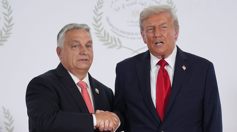 President Donald Trump greets Hungary's Prime Minister Viktor Orban during a summit to support ending the more than two-year Israel-Hamas war in Gaza after a breakthrough ceasefire deal, Monday, Oct. 13, 2025, in Sharm El Sheikh, Egypt. (AP Photo/Evan Vucci, Pool)