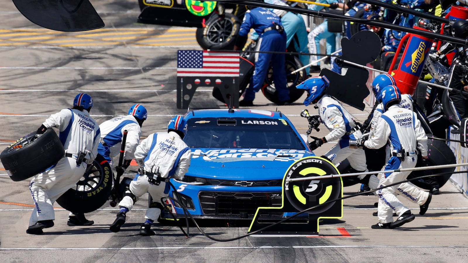 Kyle Larson gets a new set of tires during a stop on pit road in a NASCAR Cup Series auto race at Kansas Speedway in Kansas City, Kan., Sunday, May 11, 2025. (AP Photo/Colin E. Braley)