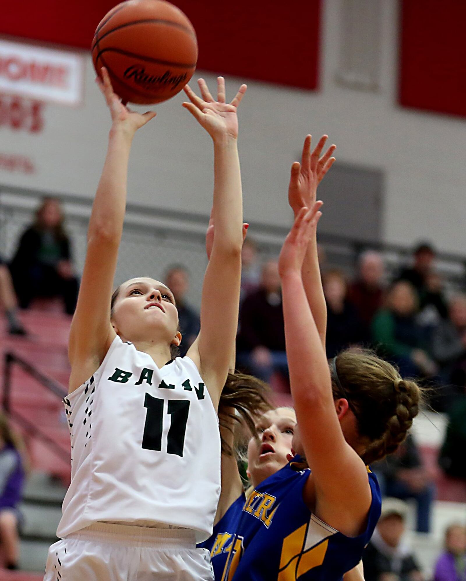 Badin guard Emily Maher scores two points against Madeira’s Molly Buzek on Saturday afternoon during a Division III sectional final at Fairfield Arena. CONTRIBUTED PHOTO BY E.L. HUBBARD