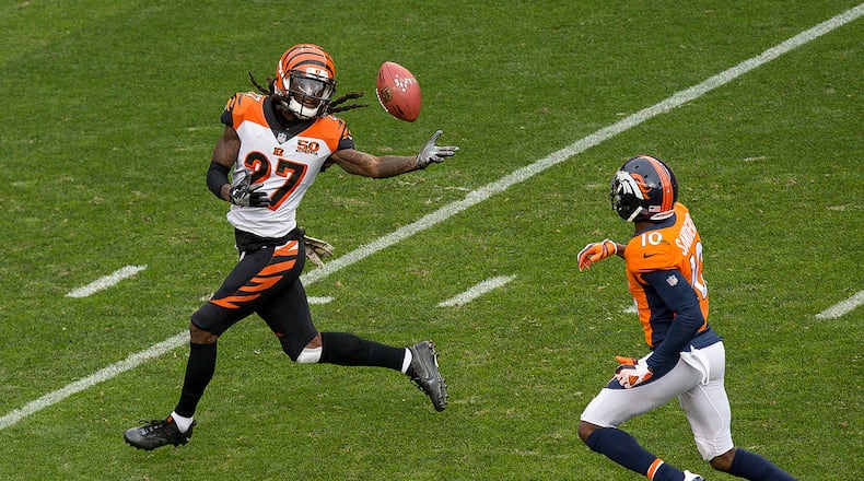 DENVER, CO - NOVEMBER 19: Cornerback Dre Kirkpatrick #27 of the Cincinnati Bengals fumbles the ball after an 87 yard return and is chased down by wide receiver Emmanuel Sanders #10 of the Denver Broncos after intercepting a pass in the first quarter of a game at Sports Authority Field at Mile High on November 19, 2017 in Denver, Colorado. Kirkpatrick recovered the fumble. (Photo by Justin Edmonds/Getty Images)