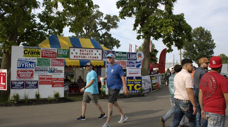 Volunteers sit in the Butler County Republicans tent at the Butler county Fairgrounds to answer voters questions and show support for candidates across Ohio.
