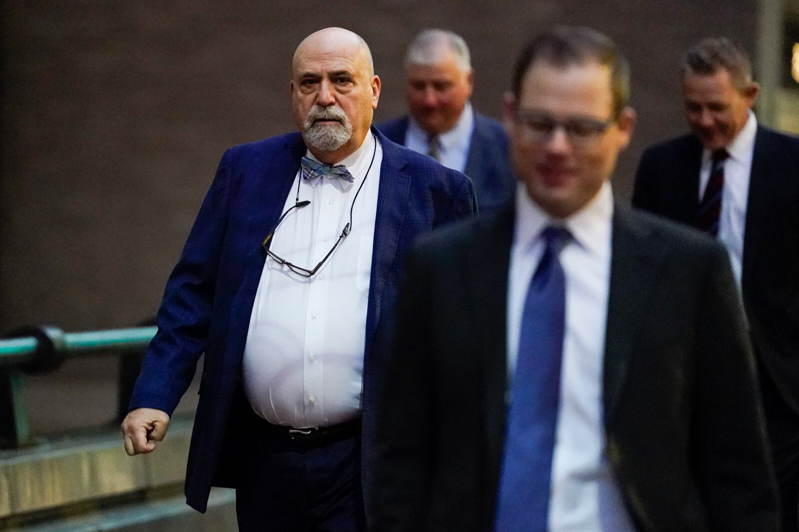 Defense attorney Mark Marein, left, walks toward Potter Stewart U.S. Courthouse before jury selection in the federal trial of former Ohio House Speaker Larry Householder, Friday, Jan. 20, 2023, in Cincinnati. Householder and former Ohio Republican Party chair Matt Borges are charged with racketeering in an alleged $60 million scheme to pass state legislation to secure a $1 billion bailout for two nuclear power plants owned by Akron, Ohio-based FirstEnergy. Householder and Borges have both pleaded not guilty. (AP Photo/Joshua A. Bickel)