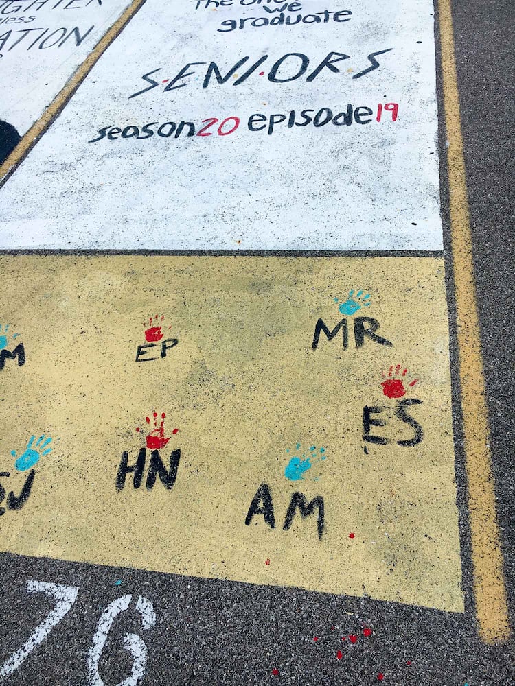 PHOTOS Lakota East seniors paint parking spots
