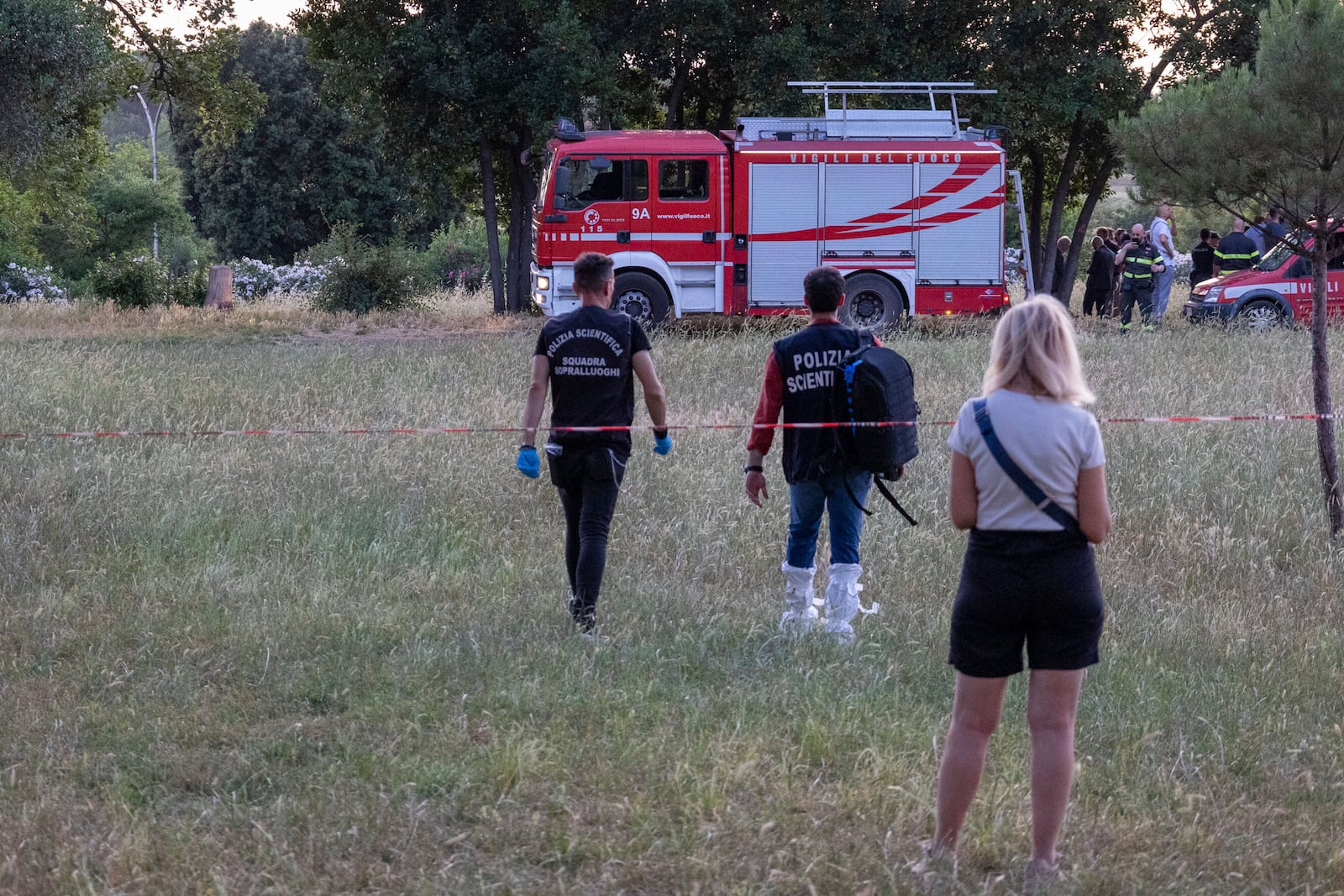 A firefighter truck and forensic police work at the site of the discovery of the body of an infant and the infant’s mother, in Rome’s Villa Pamphili park, Saturday, June 7, 2025. (Francesco Benvenuti/LaPresse via AP)