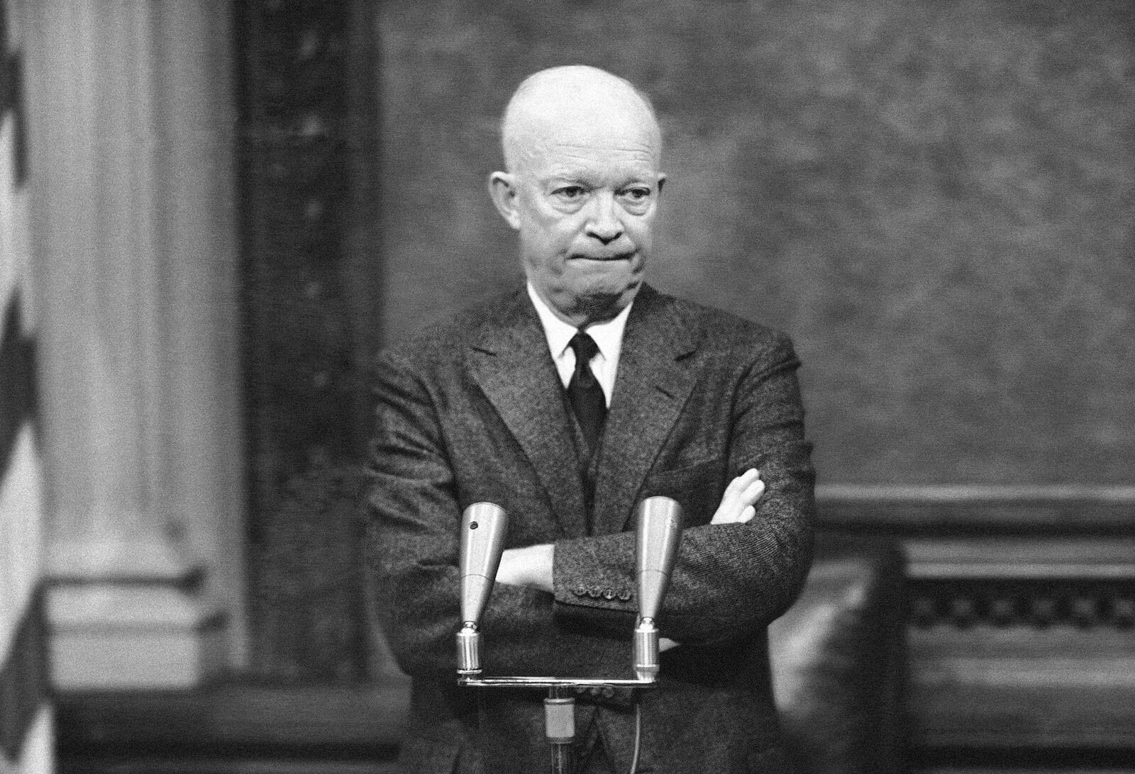 FILE - President Dwight Eisenhower ponders a question from a reporter during a meeting with the press in Washington, D.C., Jan. 19, 1956. (AP Photo, File)