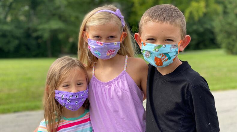 Stella, Savannah and Owen Bettag are getting ready to go back to school by wearing their masks whenever they go out in public. The children attend Wayne Local Schools in Waynesville where Savannah will be a third grader, Owen, a second grader and Stella, a preschooler. CONTRIBUTED